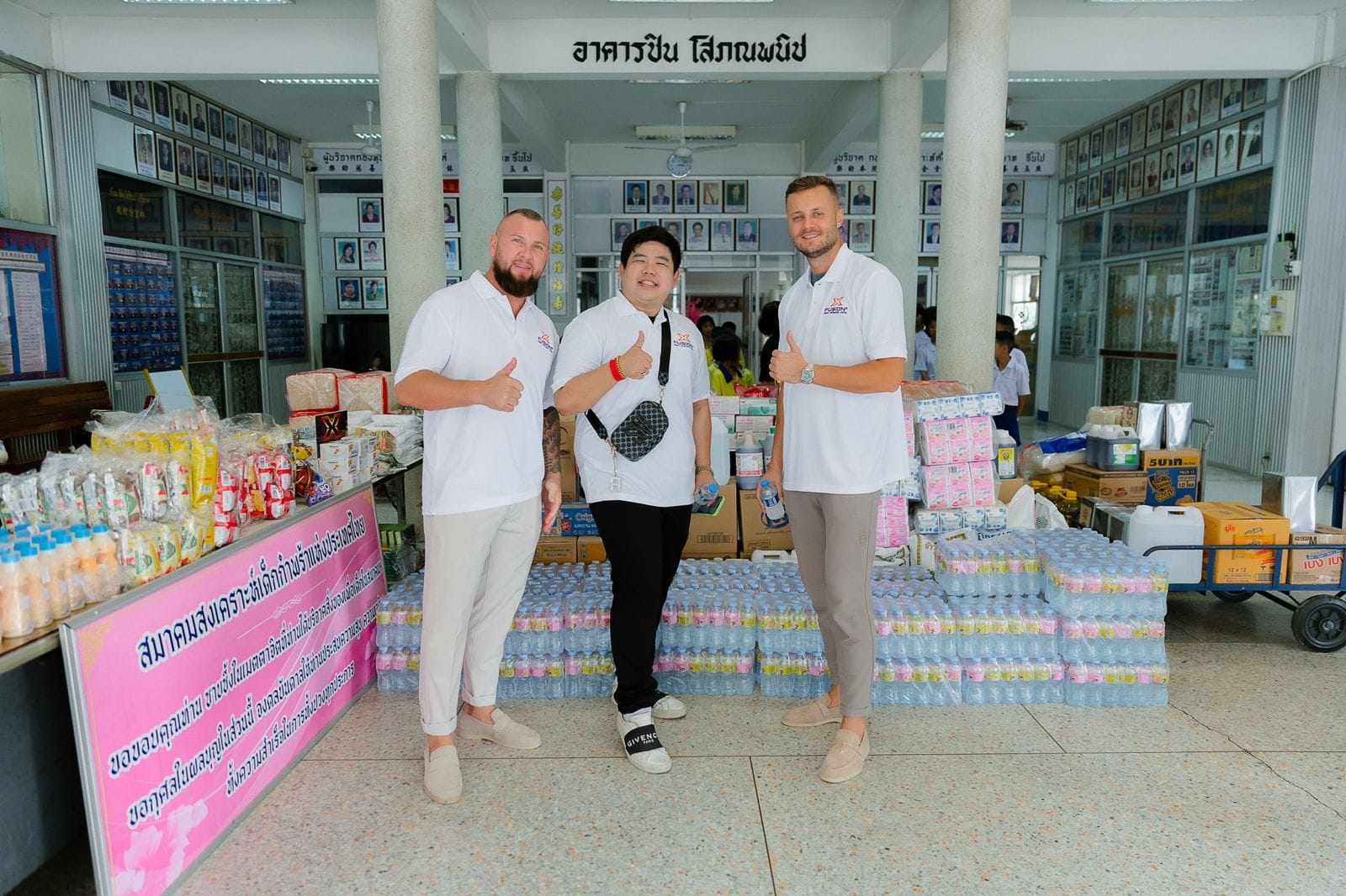 Zeljko Cikojevic and partners presenting donated goods