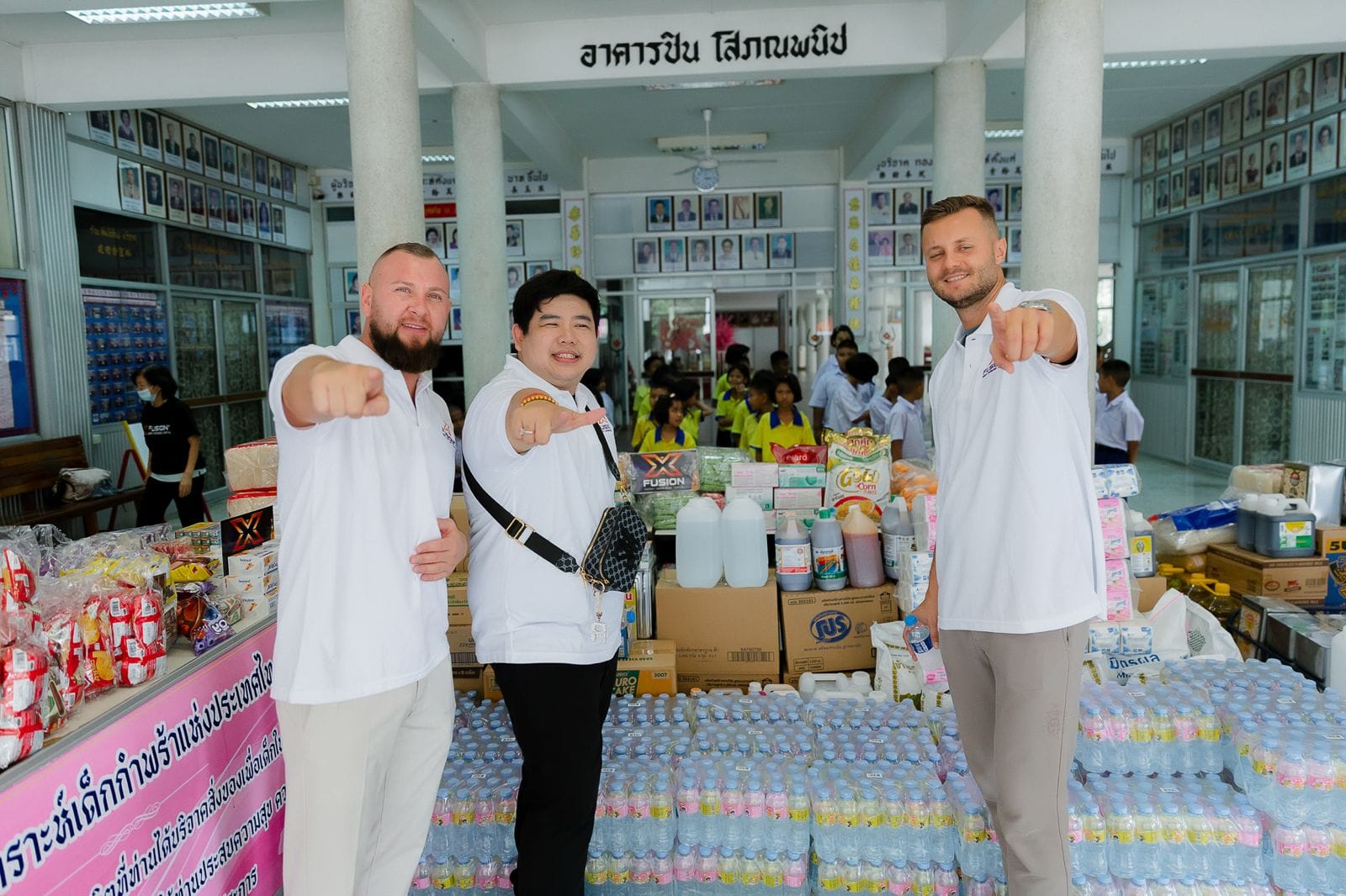 Zeljko Cikojevic and partners with donated supplies at a charity event